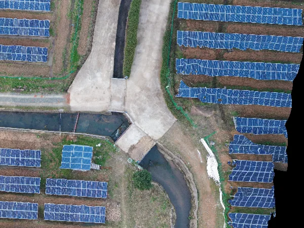 Detail crop from the stitched output showing a road junction between solar panels